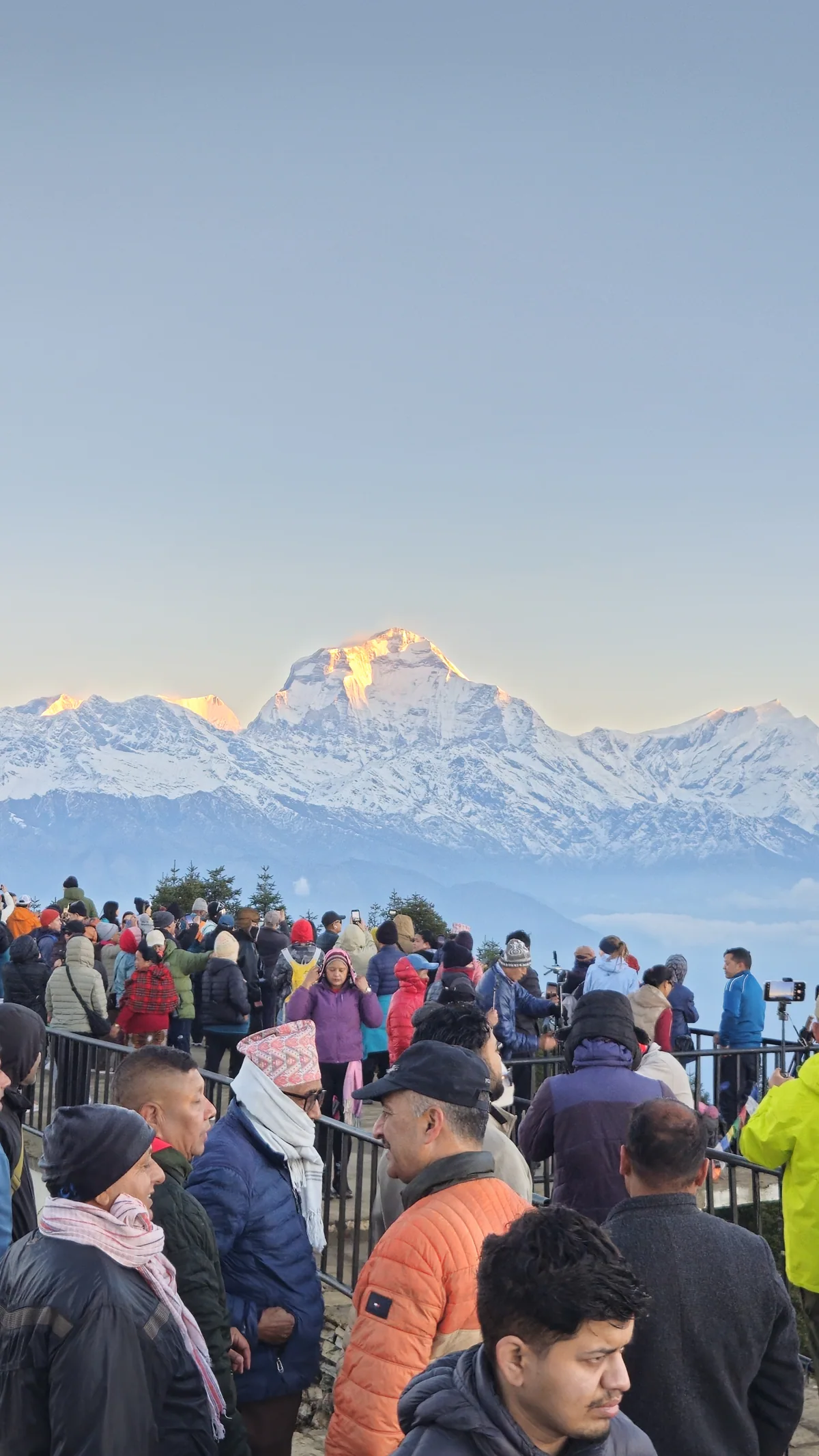 Trekkers gathering at a mountain viewpoint on the Panchase journey